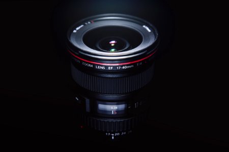 Black Ef 17-40mm Camera Lens in Dark Surface photo