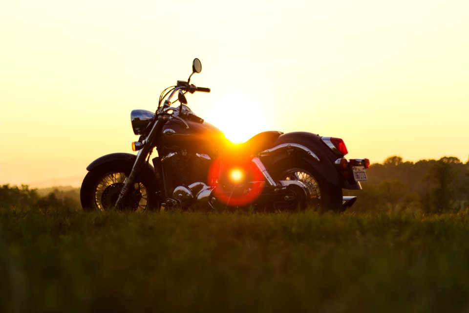 Black Cruiser Motorcycle Parked on Grassfield