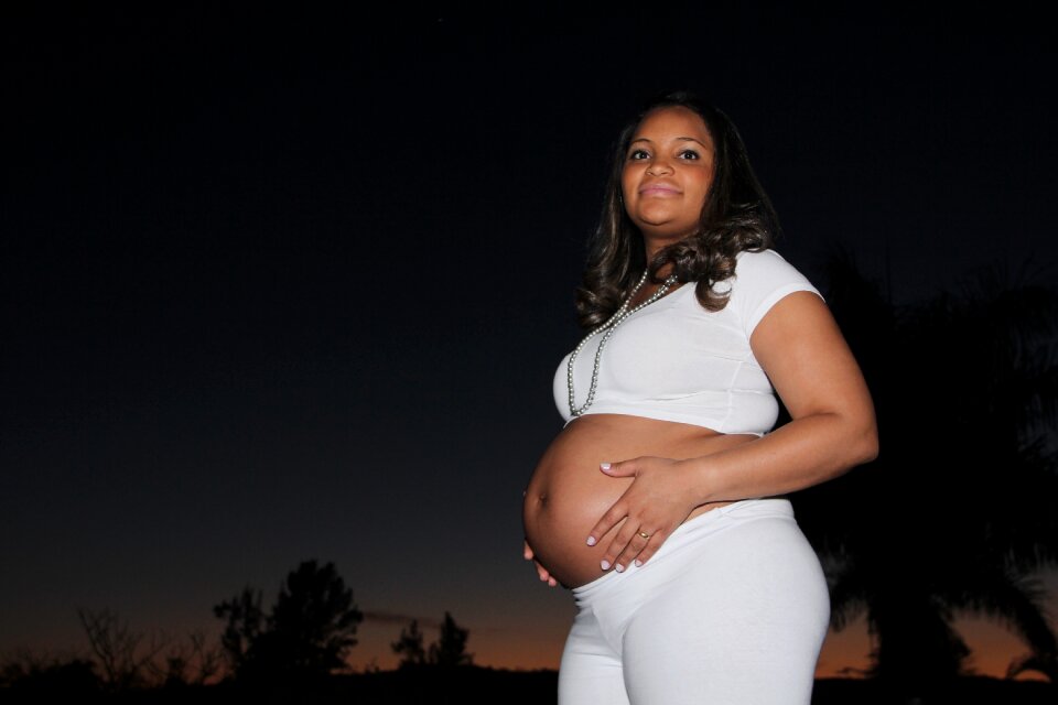 White dress tender future mother