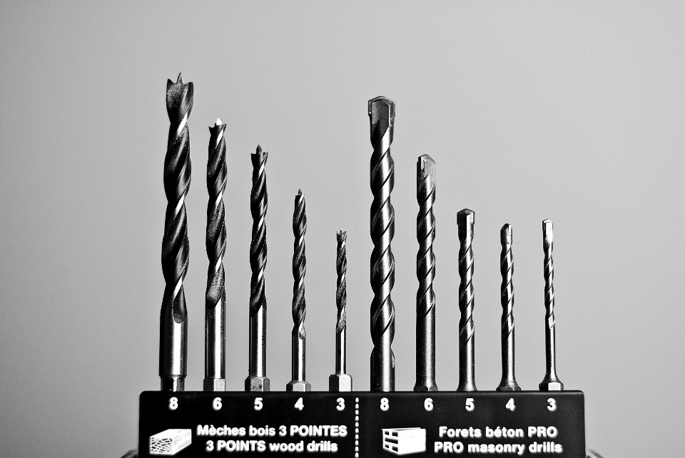 Grayscale Photography of Masonry and Wood Drills photo