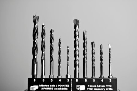 Grayscale Photography of Masonry and Wood Drills
