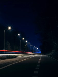 Road Near Post Lamp at Night Time photo