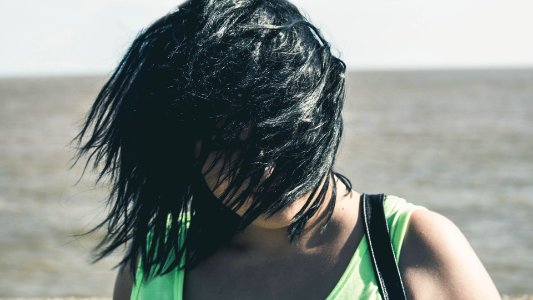 Woman Covered Her Face With Hair photo