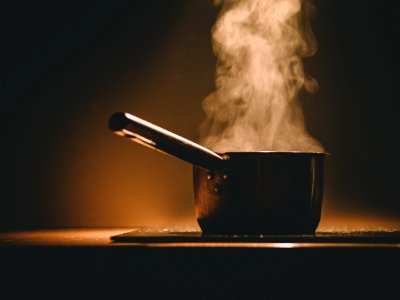 Black Cooking Pot and Smoke in Close-up Photography photo