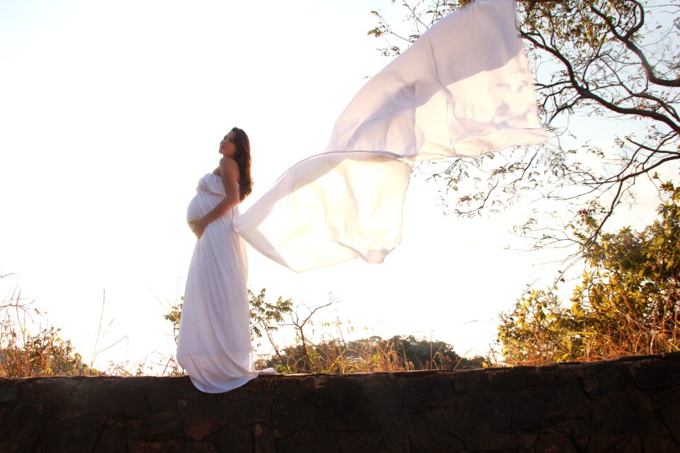 White dress tender future mother