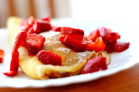 Crepe With Sliced Strawberries on Plate photo