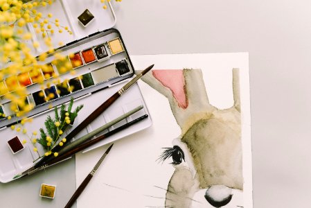Photo Of Art Materials And Easter Bunny Painting photo