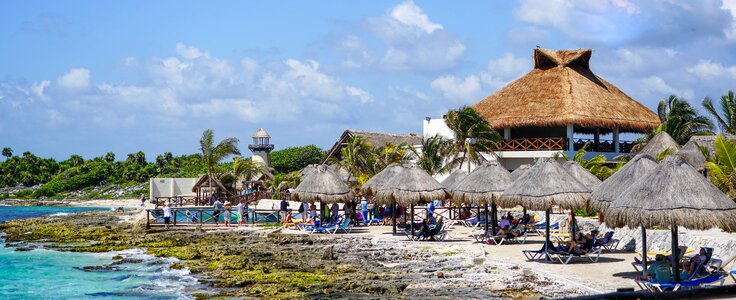 Tropical huts coastline photo