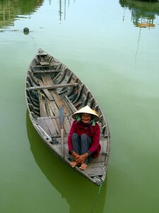 Senior woman boat green boat