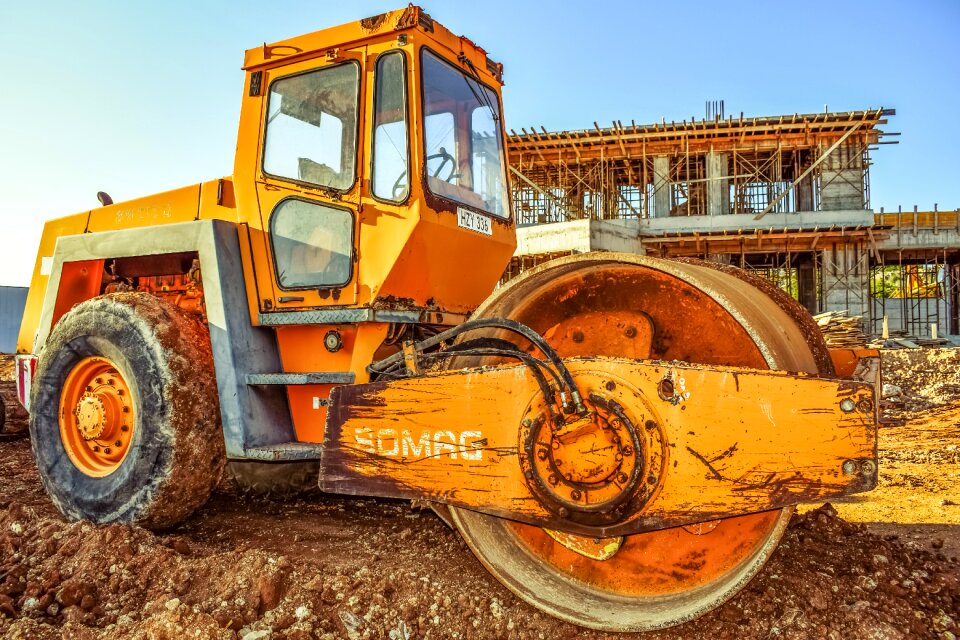 Compactor under construction yellow