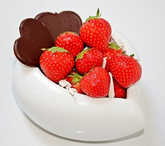 About love for mother's day chocolate heart porcelain heart with strawberries photo