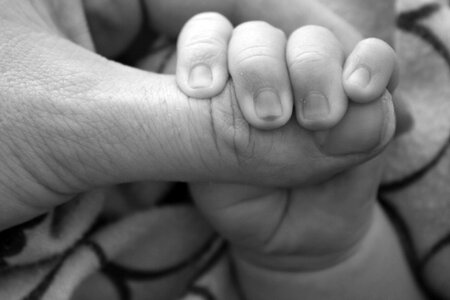 Caring hands mother newborn photo