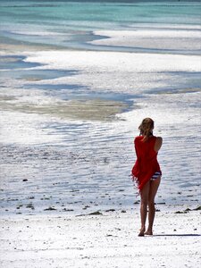 Woman sea walk on the beach photo