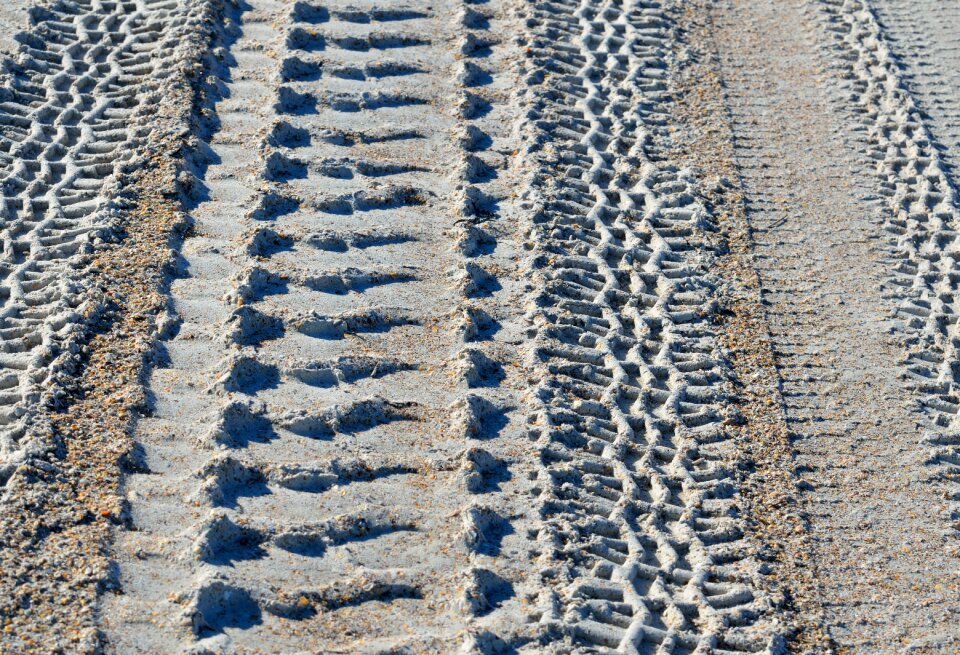 Tracks abstract beach sand