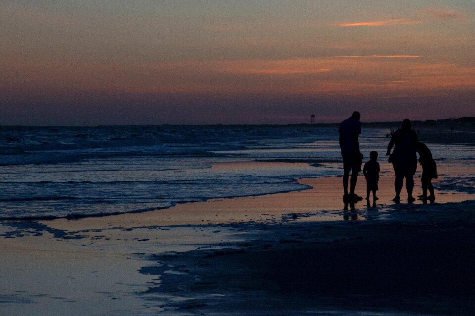 Family sunset beach