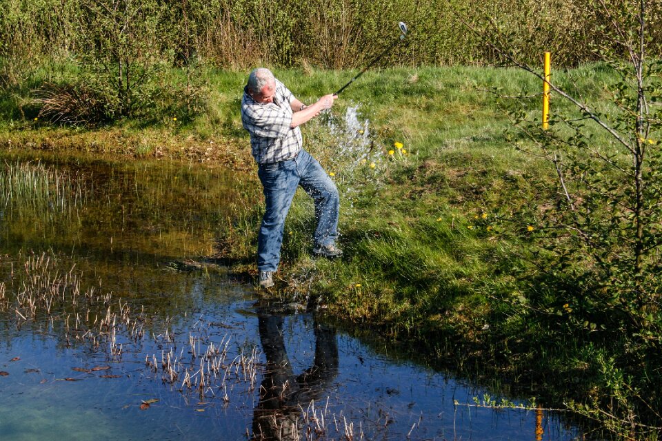Water hazard golf swing golf course