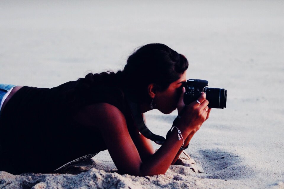 Person photographer sand