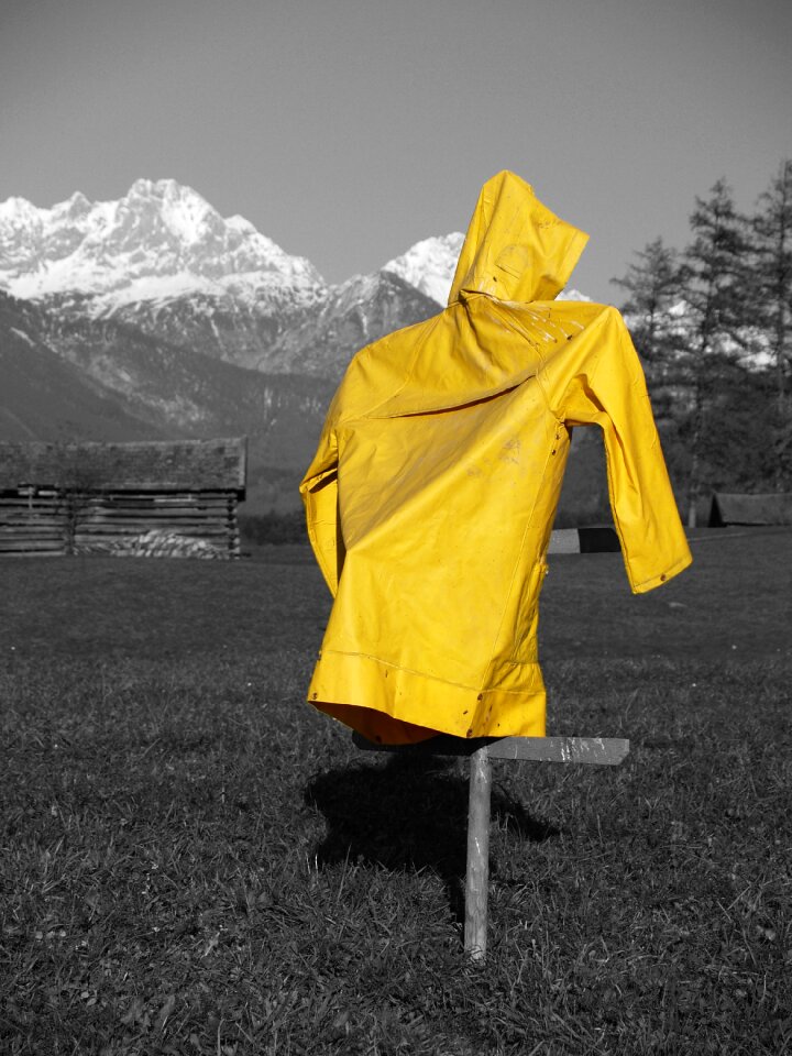 Yellow rain coat mountains