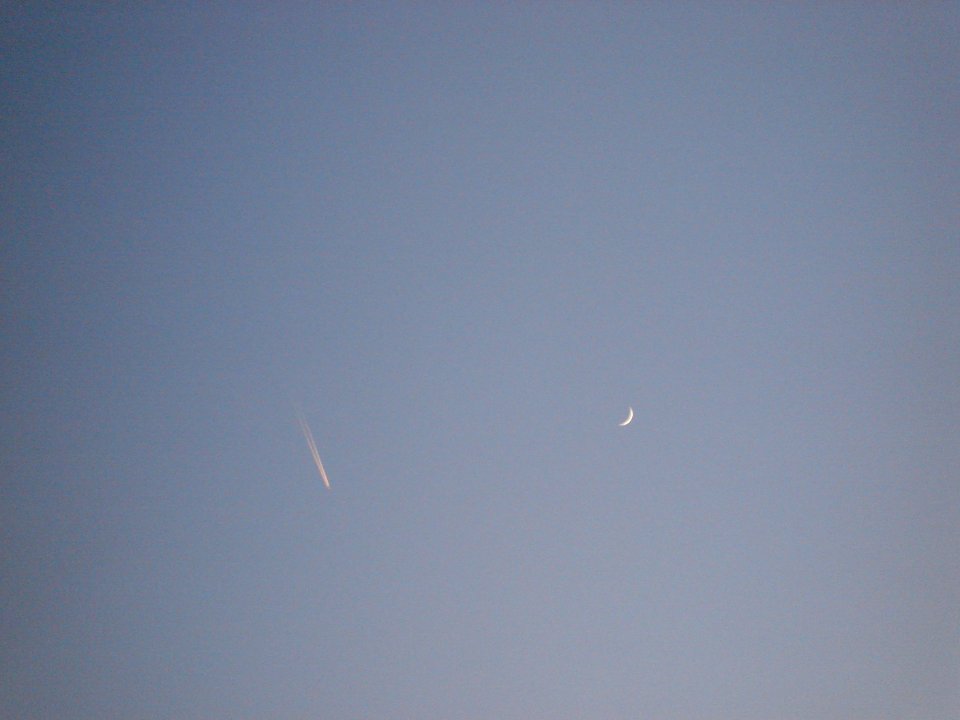 Plane and moon over Dawson, Illinois 