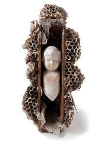 Wasp nest sculpture doll