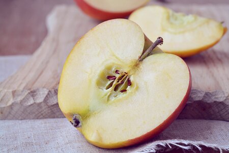 Cut in half halved apples cutting board