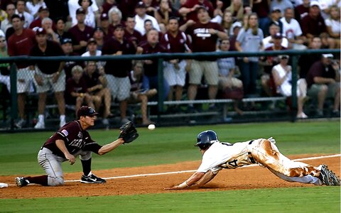 Diving into third third baseman runner photo