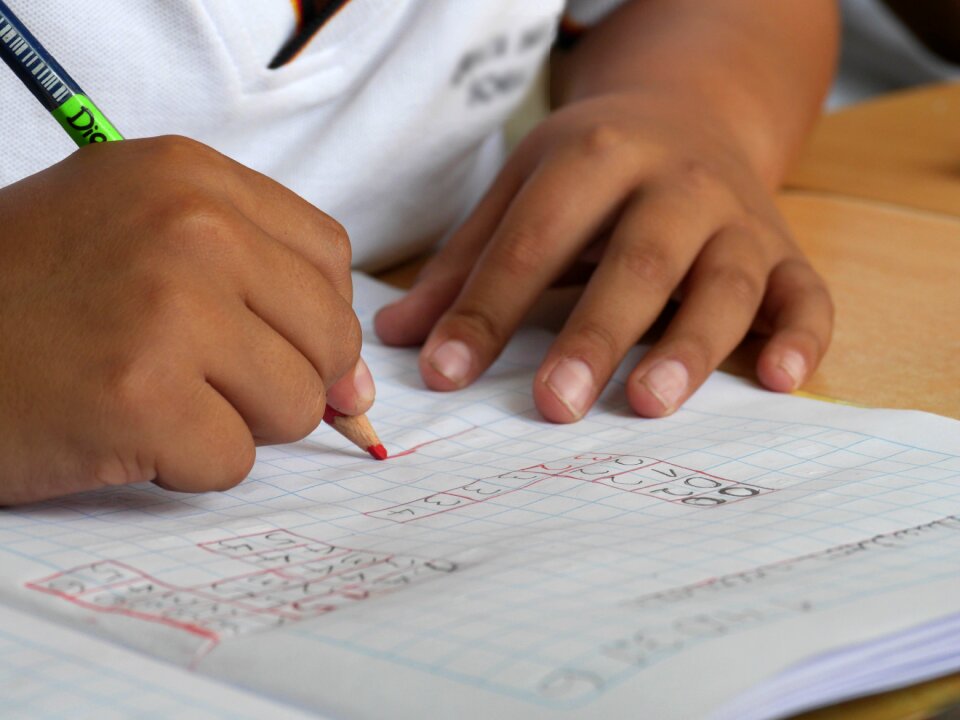 Child studying to write hands