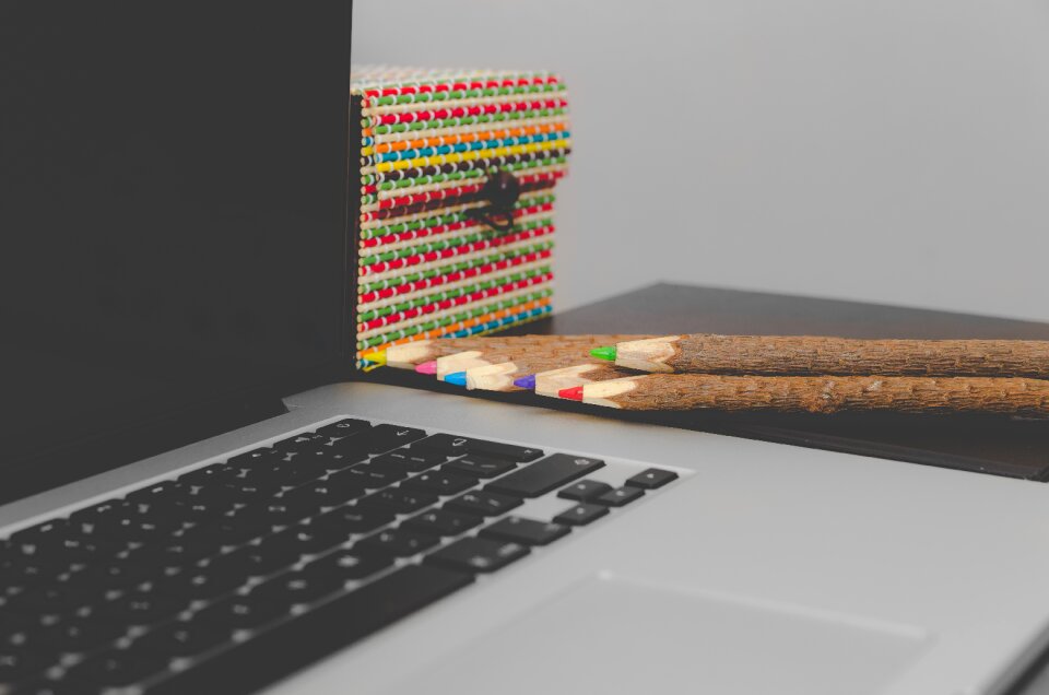 Coloured pencils computer desk photo