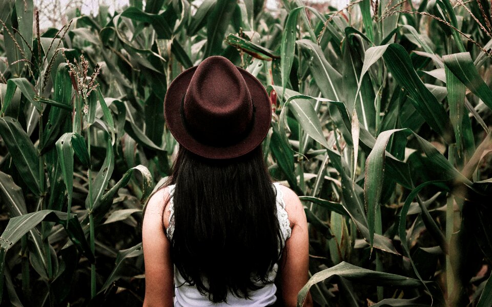 Person woman green field