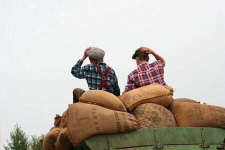 Sitting on grain bags well-wishers