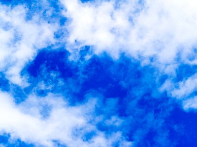 Blue white clouds form photo