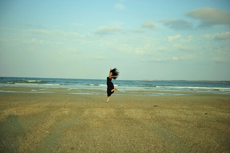 Girls jump beach