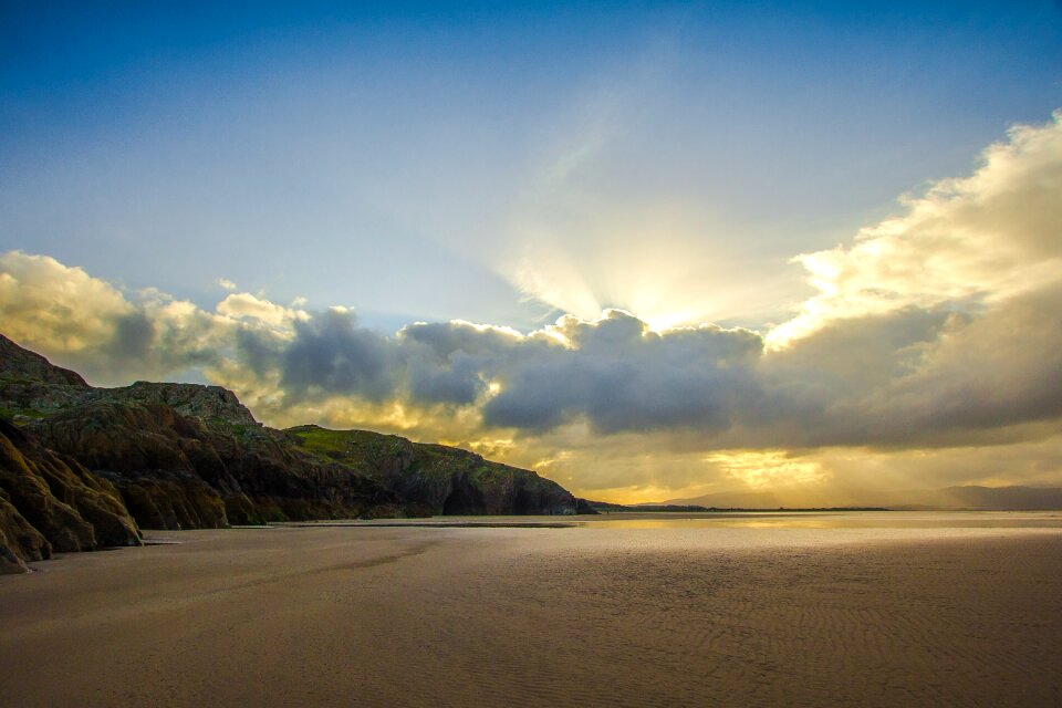 Ocean rocks clouds photo