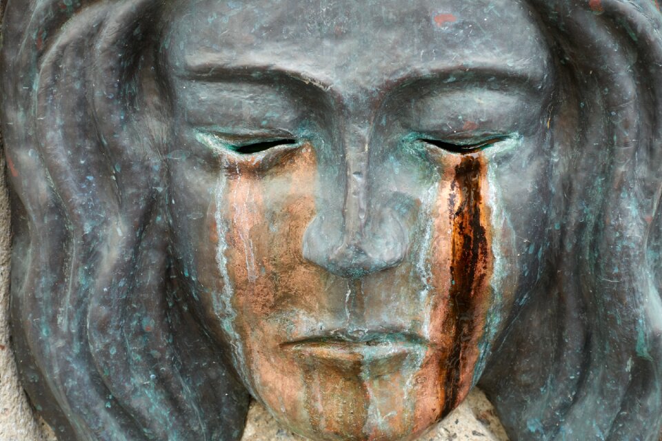 Mask tears bronze sadness