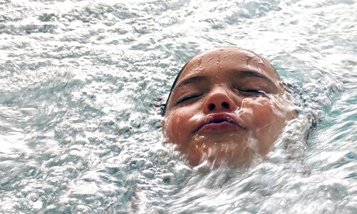 Girl swimming child photo