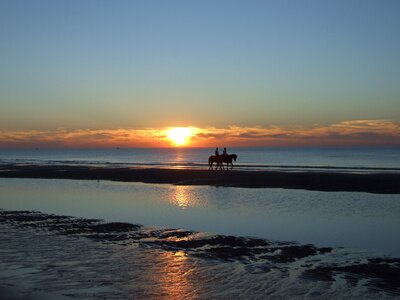 Sunset on the sea horizon riders
