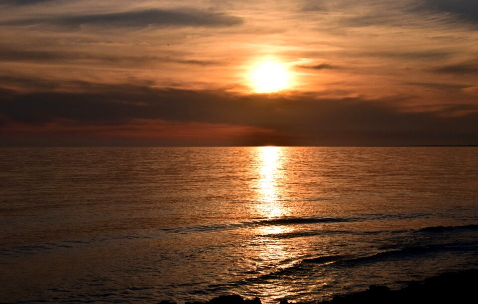 Sunset sea clouds water