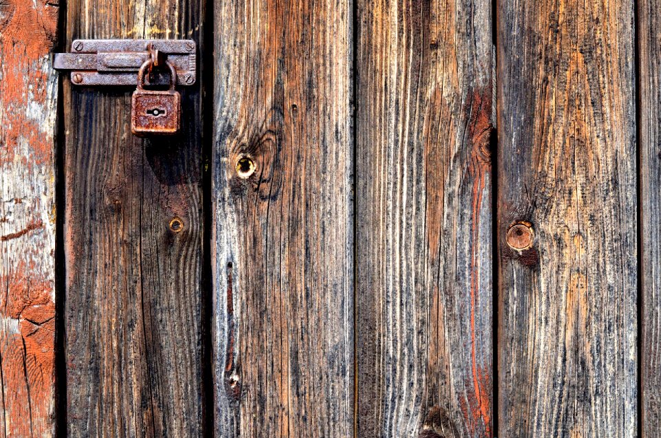 Metal padlock old cellar door