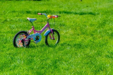 Kids bike pink bike background photo