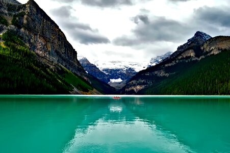 Canoe fishing mountains photo