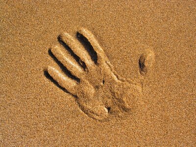 Hand sand beach photo