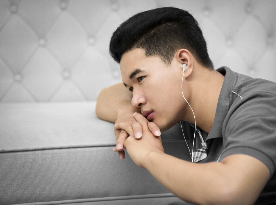 Young listen to music headphone