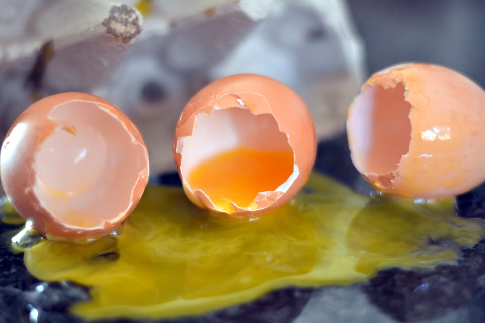Broken eggs yellow yolk food