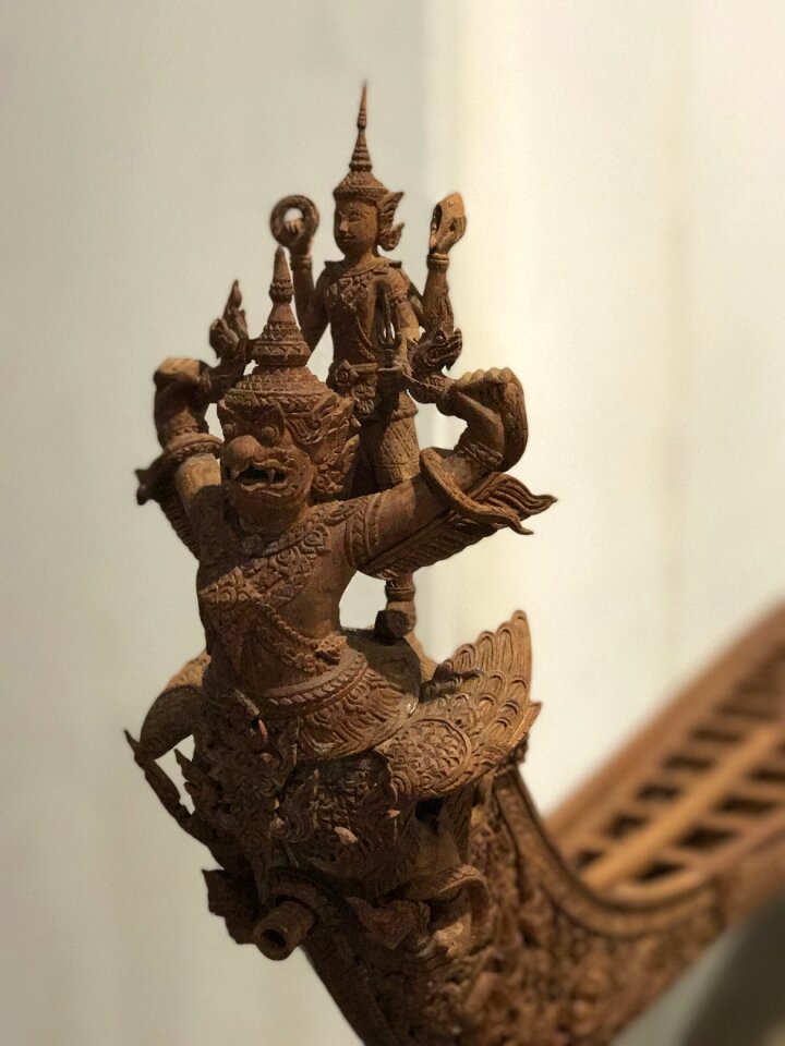 Wood carving royal barge vishnu photo