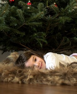 Xmas tree relaxing kid photo