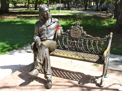 Park bench work of art bronze statue photo