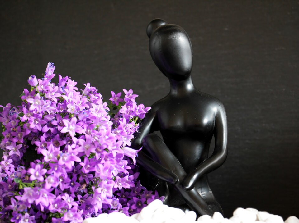 Statue beautiful woman flowers