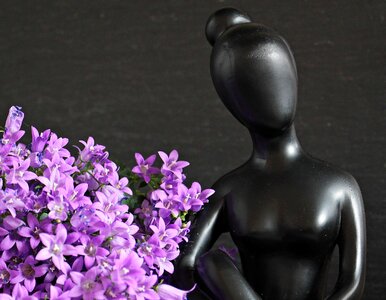 Statue beautiful woman flowers