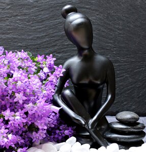 Statue beautiful woman flowers