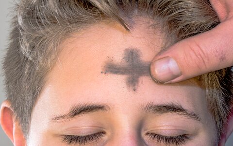 Cross forehead religious